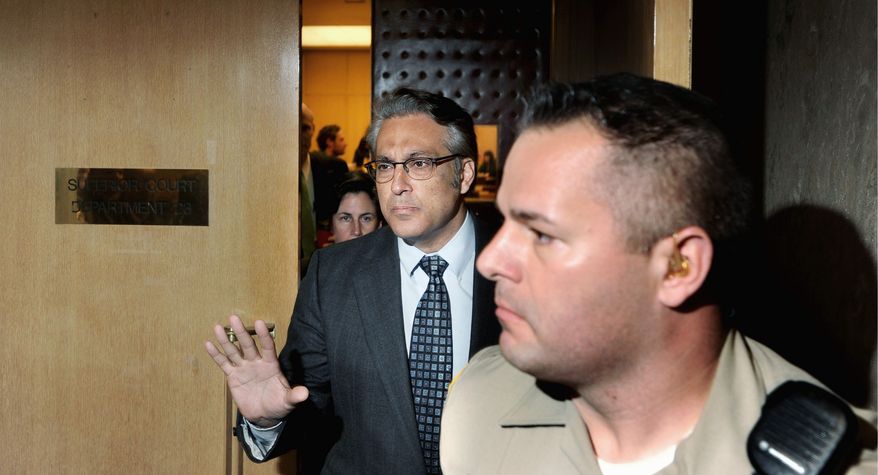 San Francisco Sheriff Ross Mirkarimi (left) leaves court Monday after pleading guilty to a misdemeanor charge of false imprisonment. He could still be ousted by the city's Board of Supervisors. (Associated Press)