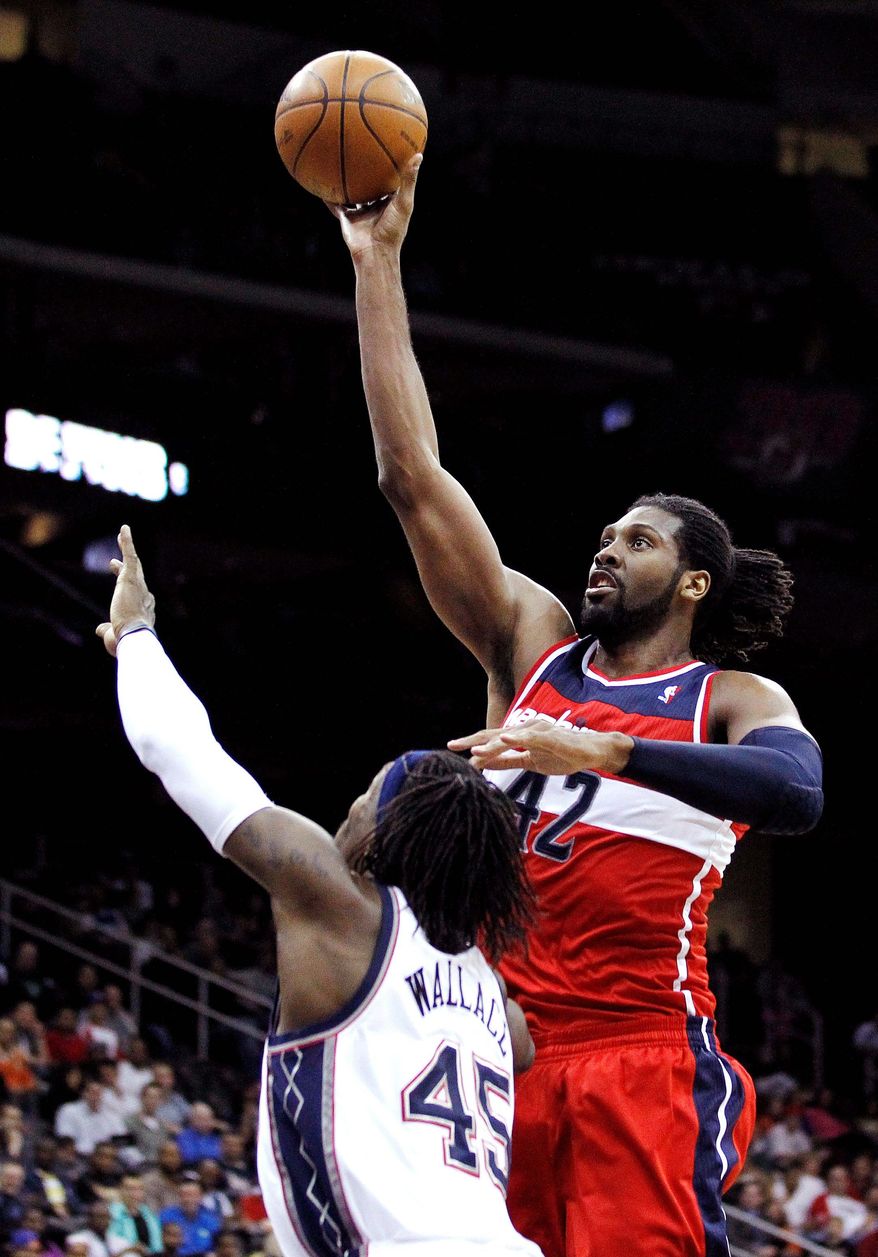 New Wizards center Nene scored 22 points and snared 10 rebounds in a 108-89 win at New Jersey on Wednesday. (Associated Press)