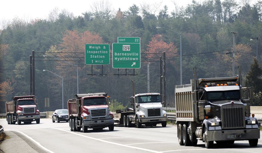 Northbound vehicles drive on Interstate 270 past the exit to Hyattstown, Md., on March 23, 2012. (Associated Press)