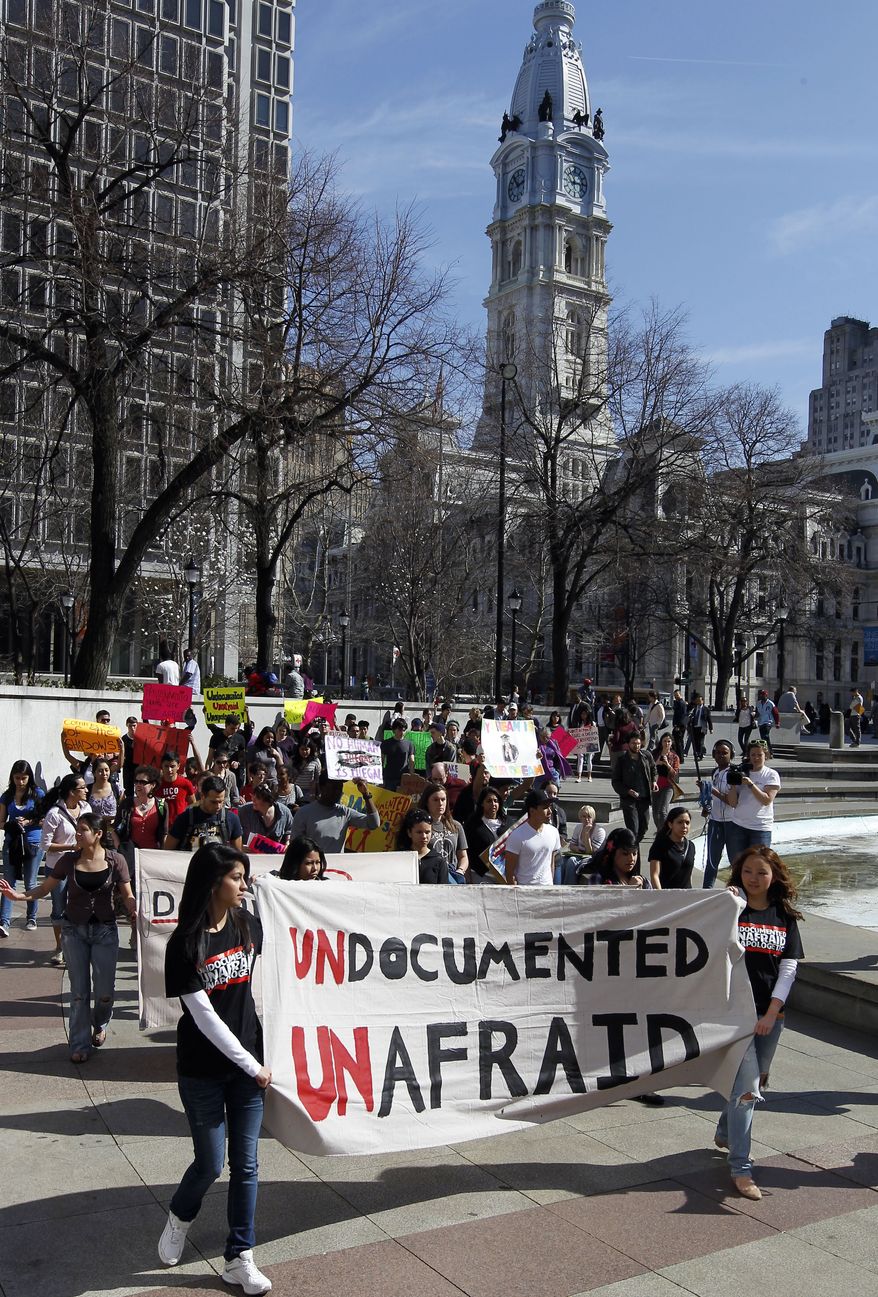 Protesters in support of undocumented youth march March 14, 2012, in Philadelphia from Love Park to the U.S. Immigration and Customs Enforcement office. (Associated Press)