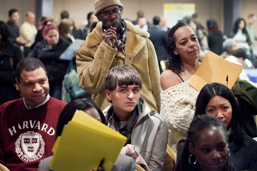 ** FILE ** Job seekers attend a National Career Fair in New York on Wednesday, Feb. 22, 2012. (AP Photo/Mark Lennihan)