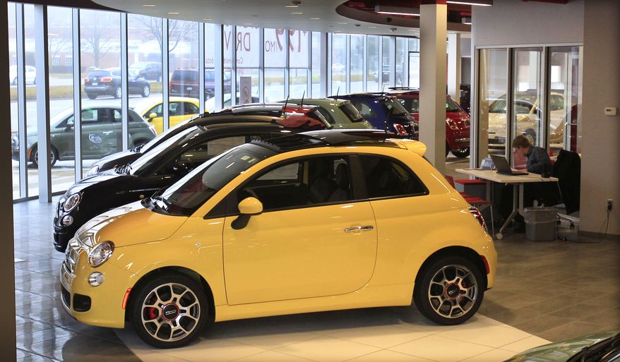 Fiat 500 vehicles are on show at the Golling Fiat dealership in Birmingham, Mich., on Wednesday, Feb. 29, 2012. (AP Photo/Carlos Osorio)