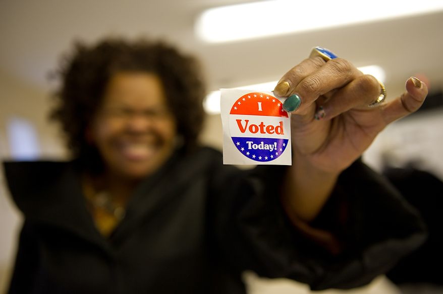 Joyce Reed of Ward 8 casts her vote at Precinct 116 inside the New Image Baptist Church on Alabama Avenue Southeast in Washington on Tuesday, April 3, 2012. (Andrew Harnik/The Washington Times)