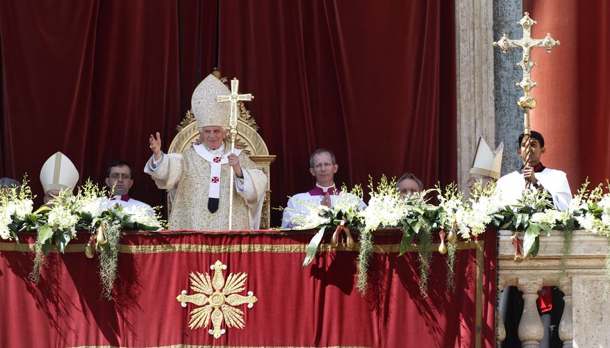 Pope Benedict XVI greets the faithful after his "Urbi and Orbi" ("to the city and to the world") blessing following Easter Mass in St. Peter's Square at the the Vatican on Sunday, April 8, 2012. (AP Photo/Pier Paolo Cito)