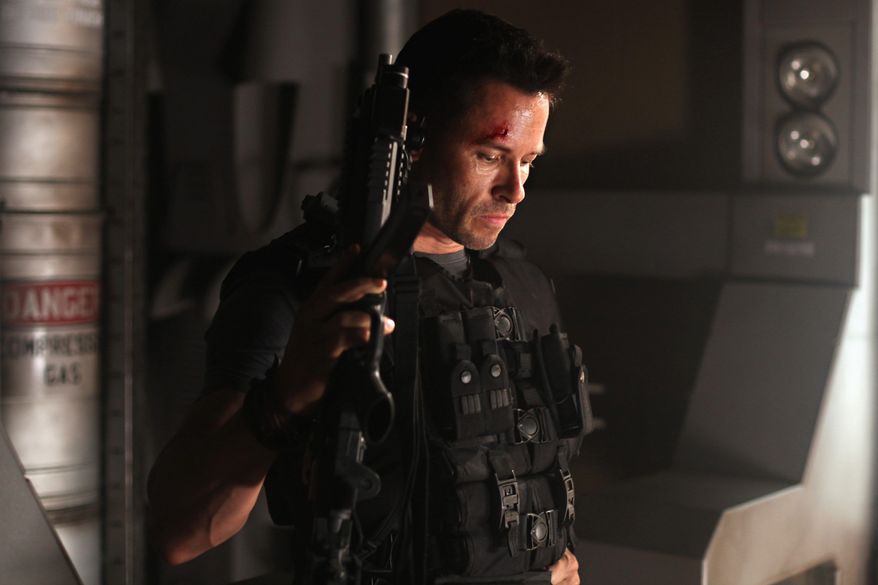 Guy Pearce is so glib and entertaining in the space-prison sci-fi movie "Lockout" that he almost makes up for the production's numerous deficiencies. (Film District via Associated Press)