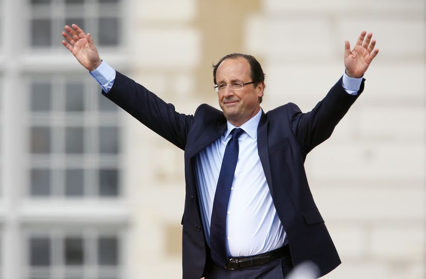 Francois Hollande, the Socialist Party's candidate for French president, gestures to supporters following his speech at a campaign rally in Vincennes, France, outside Paris, on Sunday, April 15, 2012. (AP Photo/Francois Mori)