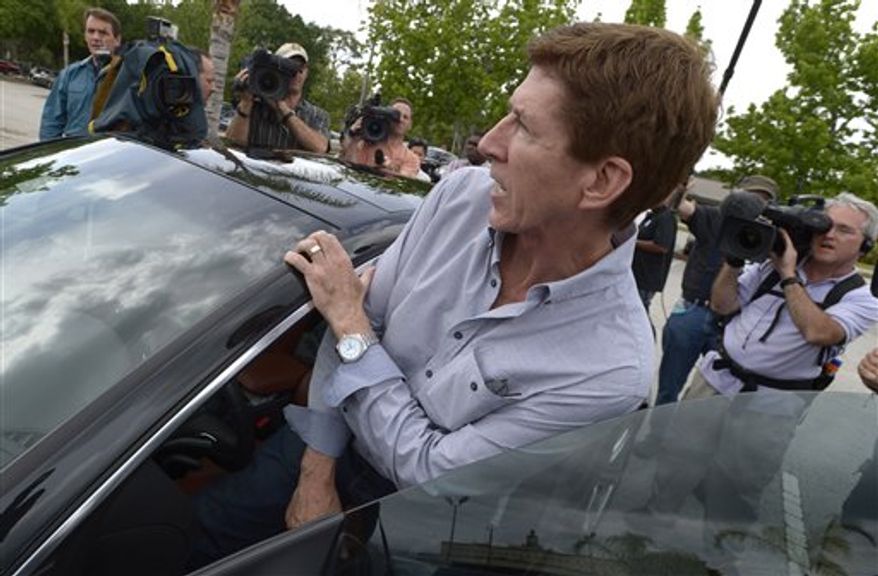 Mark O'Mara, attorney for George Zimmerman, gets into his car after speaking with his client at the Seminole County Jail in Sanford, Fla. on Saturday, April 21, 2012. Zimmerman was a neighborhood watch volunteer who shot unarmed teenager, Trayvon Martin. O'Mara said it would take a few days before Zimmerman is released. His family needs time to secure collateral for the bail, Zimmerman needs to be fitted with an electronic monitoring device and O'Mara said he must find a secure location for him. (AP Photo/Phelan M. Ebenhack)