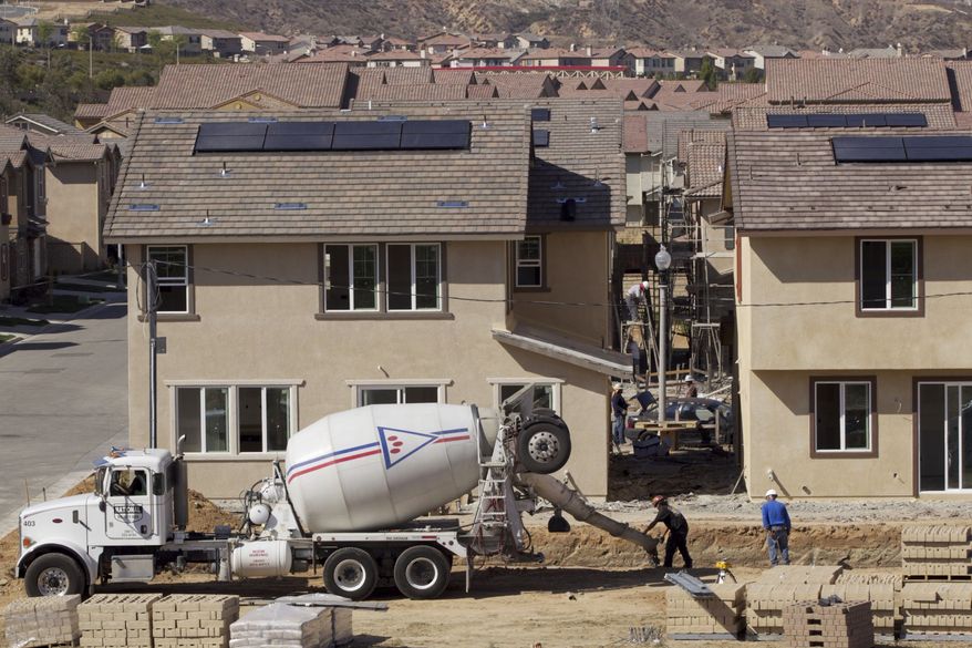 ** FILE ** In this photo taken March 15, 2012, new single-family detached homes are being built by Lennar at the "Aria at West Creek" development in Santa Clarita, Calif. (AP Photo/Damian Dovarganes)