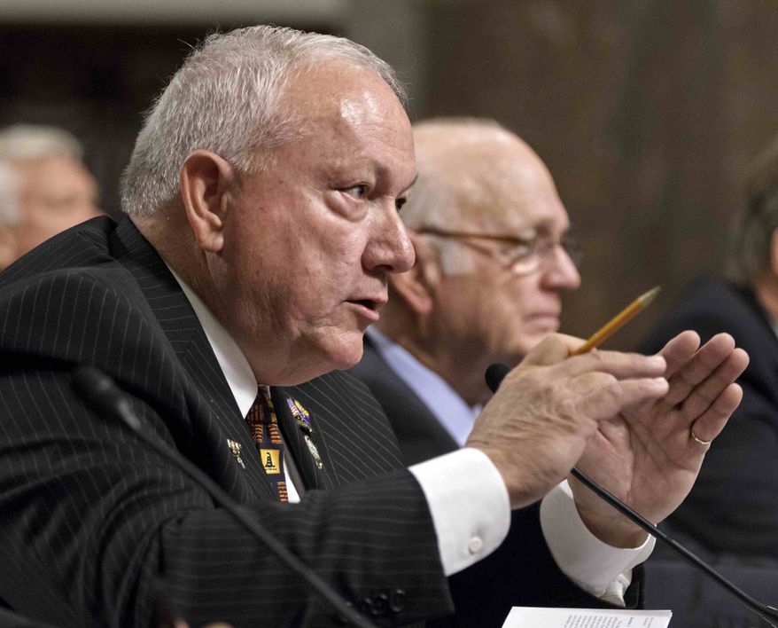 Former Arizona state Sen. Russell Pearce, the architect of Arizona's controversial immigration law S.B. 1070, left, accompanied by former Arizona Sen. Dennis DeConcini, testifies on Capitol Hill in Washington, Tuesday, April 24, 2012, before the Senate Immigration, Refugees and Border Security subcommittee hearing titled "Examining the Constitutionality and Prudence of State and Local Governments Enforcing Immigration Law." (AP Photo/J. Scott Applewhite)