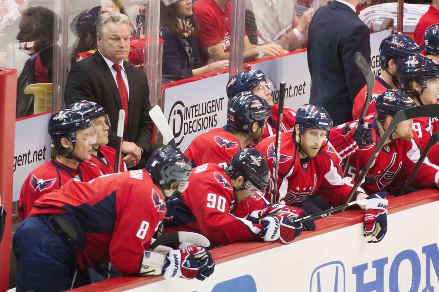 Capitals coach Dale Hunter's demeanor never seems to waver, which his players see as a positive trait when the pressures of the playoffs are greatest. As a player, Hunter brought a fiery temperament to the ice. (Andrew Harnik/The Washington Times)