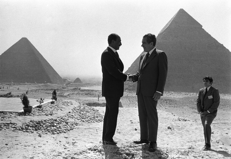 In this June 14, 1974 file photo taken by Associated Press photographer Horst Faas, Presidents Anwar Sadat and Richard Nixon shake hands for photographers as they pose in front of the pyramids at Giza, near Cairo. Faas, a prize-winning combat photographer who carved out new standards for covering war with a camera and became one of the world's legendary photojournalists in nearly half a century with The Associated Press, died Thursday May 10, 2012. He was 79. (AP Photo/Horst Faas, File)