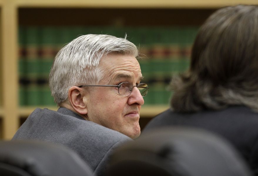 Steve Powell looks toward his attorneys during final arguments in his trial on voyeurism charges on Tuesday, May 15, 2012, in Tacoma, Wash. (AP Photo/Ted S. Warren)