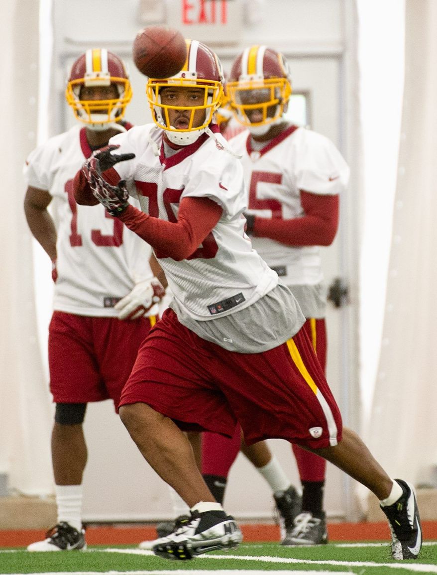 Redskins receiver Santana Moss, perhaps playing at more than his ideal weight, saw his catches, yardage and touchdowns fall by nearly a half in 2011 from what they were in 2010. (Andrew Harnik / The Washington Times)