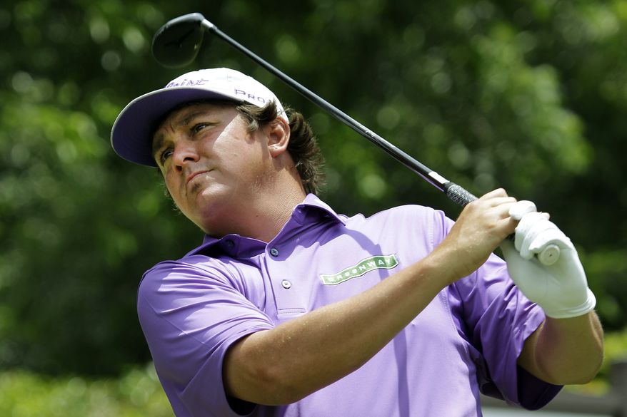 Jason Dufner watches his tee shot on the second hole during the third round of the PGA Colonial tournament, Saturday, May 26, 2012, in Fort Worth, Texas. (AP Photo/LM Otero)