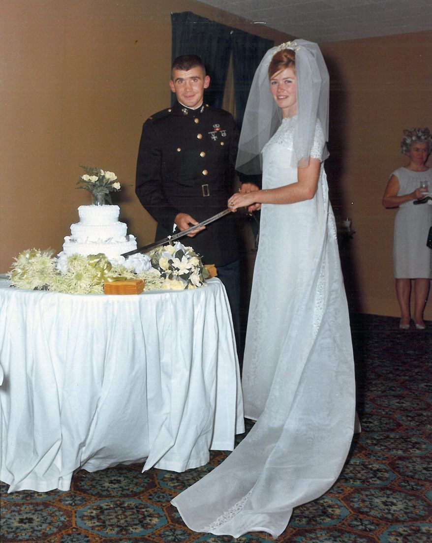 Oliver North cuts his wedding cake in 1968 with his ceremonial sword as his wife looks on. The sword was stolen and returned decades later. (Photograph courtesy Oliver North)