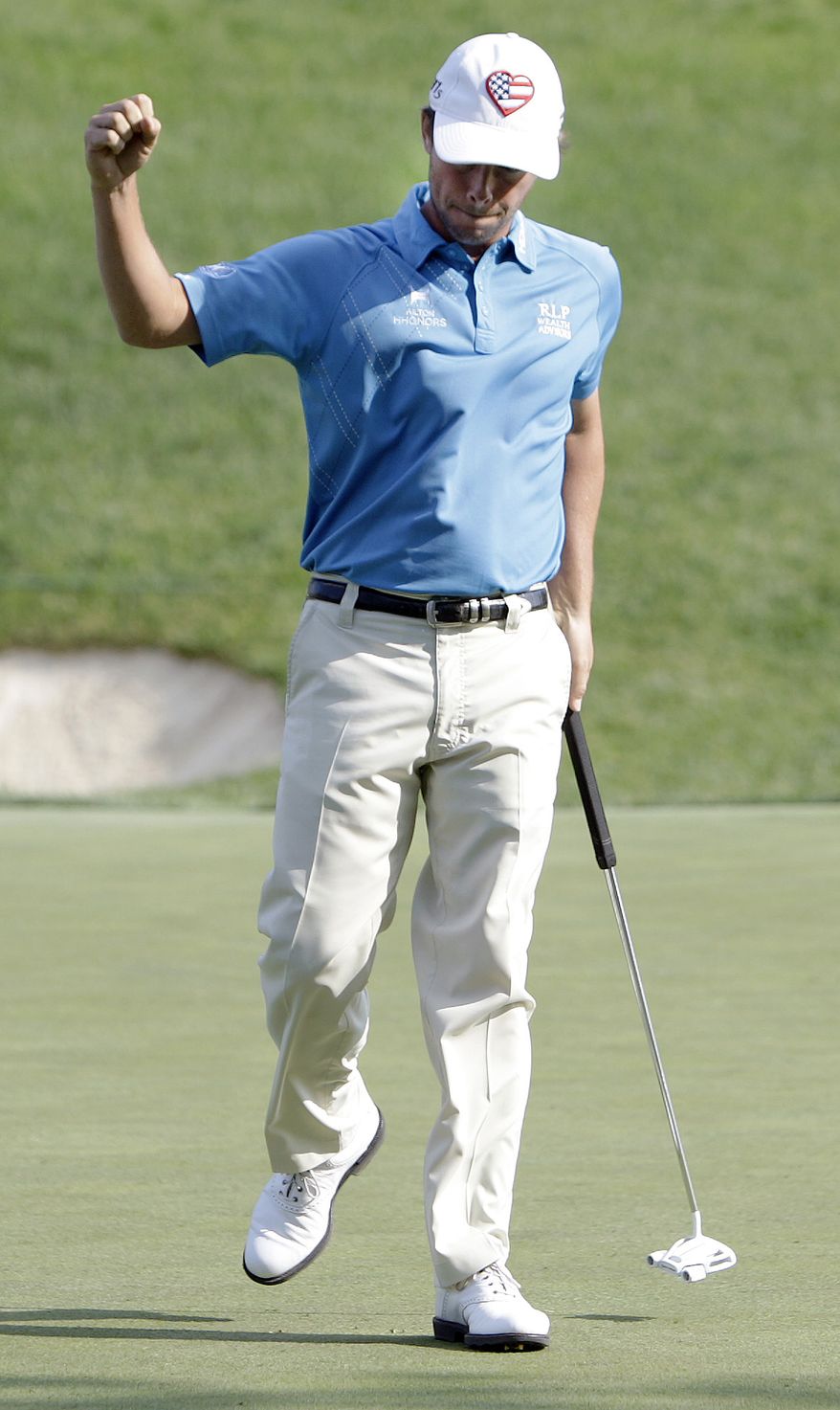 Spencer Levin reacts to making a putt on the 17th hole during the third round of the Memorial tournament Saturday, June 2, 2012, in Dublin, Ohio. (AP Photo/Jay LaPrete)