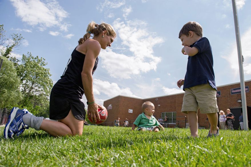 Keli Smith-Puzo of Selinsgrove, Pa., is kept busy with sons Ian, 9, and Xavi, 2, when she's not competing for a spot on the U.S. field hockey team. She scored three goals in the Beijing Games in 2008. (Andrew Harnik/The Washington Times)