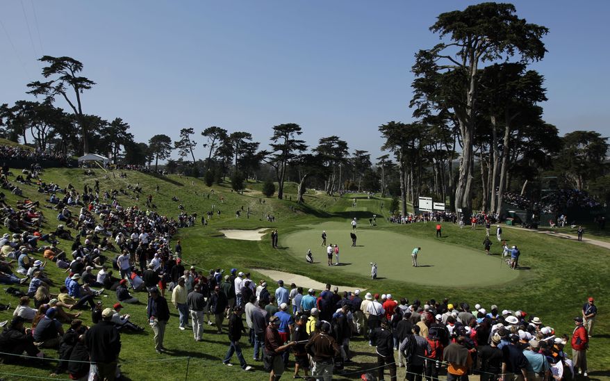 Players putt on the eighth green during a practice round for the U.S. Open Championship on Wednesday, June 13, 2012, at The Olympic Club in San Francisco. (AP Photo/Ben Margot)