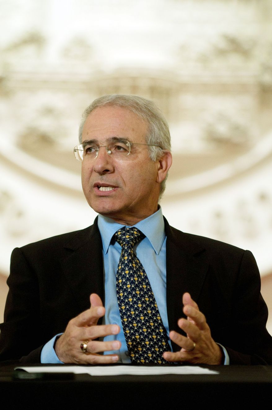 Moroccan Ambassador to the U.S. Mohammed Rachad Bouhlal talks to editors and reporters at The Washington Times on Wednesday. (J.M. Eddins Jr./The Washington Times)