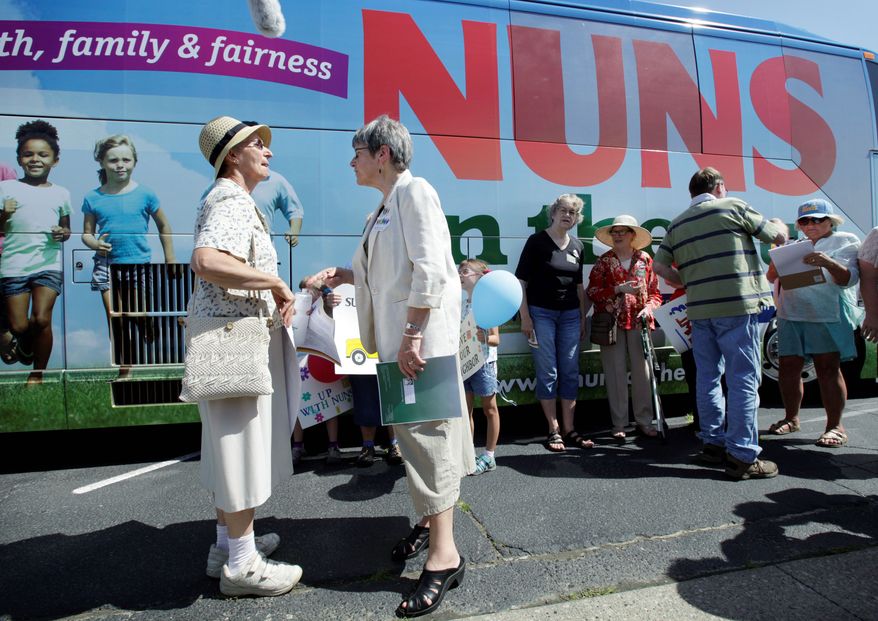 Sister Simone Campbell (right), executive director of Network, talks with Sister Lorraine Schmaltz of Ames, Iowa, on Monday, the first day of a nine-state tour protesting proposed federal budget cuts. (Associated Press)