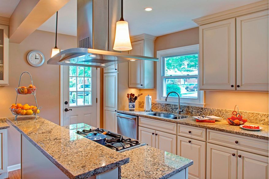 Some design solutions may involve moving walls, as was done for this family kitchen. (Photograph courtesy of Case Design/Remodeling)