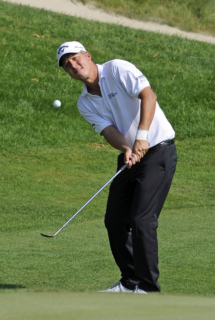 Frederik Jacobson watches his chip-shot on the 15th hole during the first round of the Travelers Championship in Cromwell, Conn., Thursday, June 21, 2012. Jacobson finished with a 5-under par 65. (AP Photo/Fred Beckham)