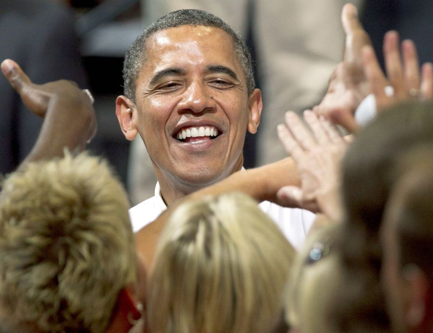 President Obama greets supporters after a campaign event at a community college in Cedar Rapids, Iowa, on Tuesday, July 10, 2012. (Associated Press)