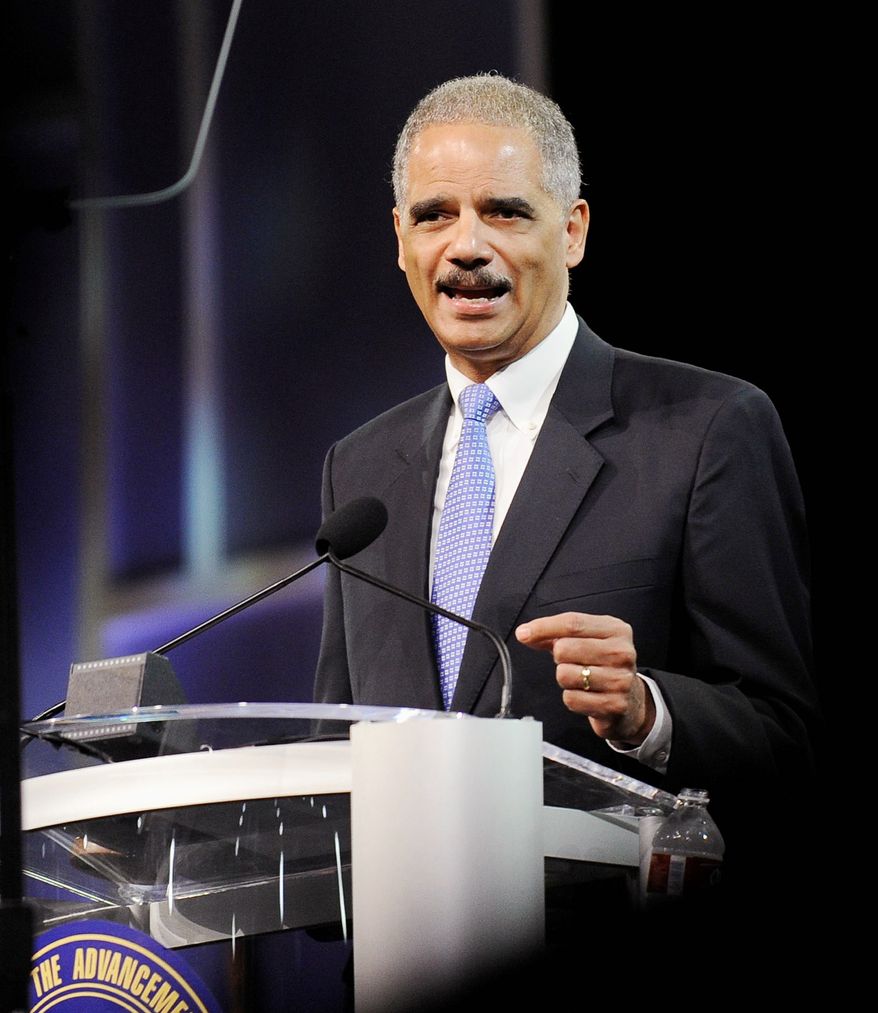 Attorney General Eric H. Holder Jr. speaks at the NAACP convention in Houston on Tuesday. Mr. Holder says a new photo-ID requirement in Texas elections would be harmful to minority voters. (Associated Press)