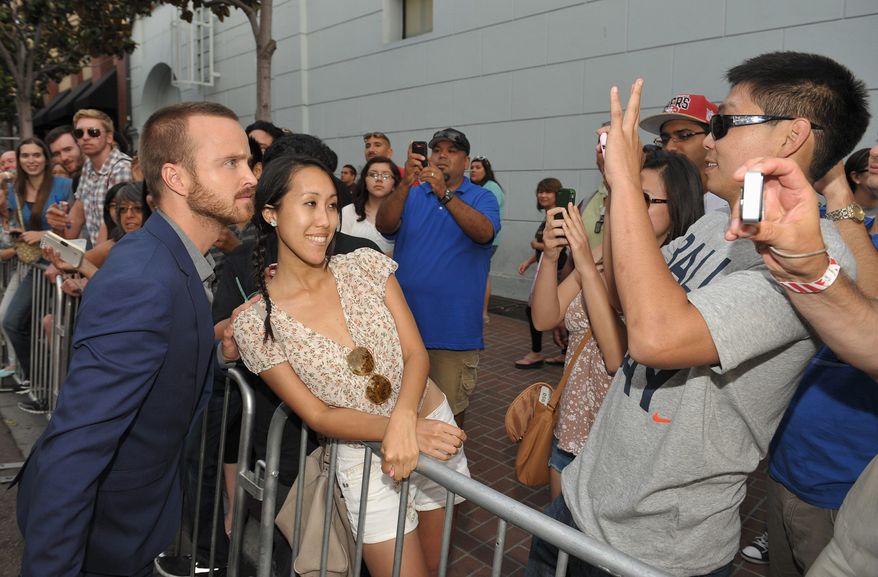 Aaron Paul greets fans at AMC's "Breaking Bad" premiere and after party on July 14, 2012 in San Diego. (John Shearer/Invision for AMC/Associated Press)
