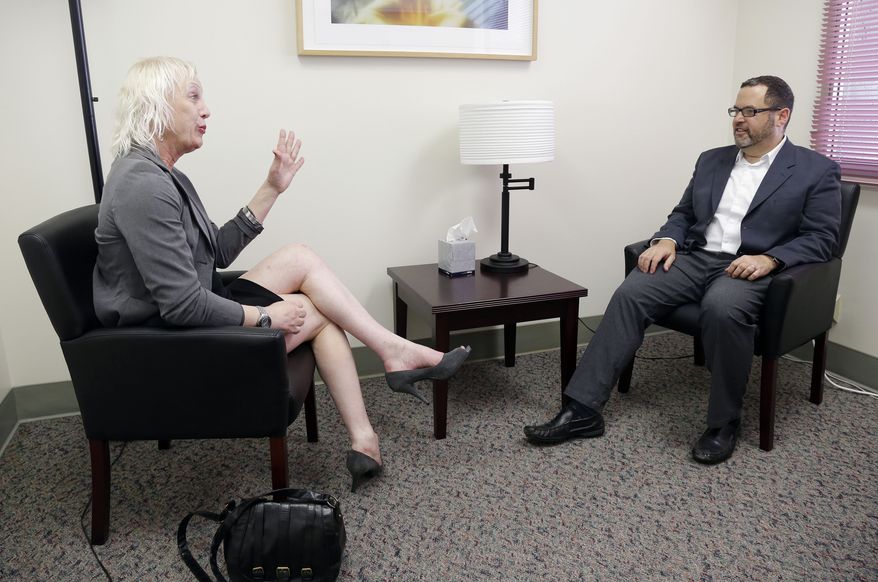 Rachel Sorrow (left), a transgender woman, attends a therapy session with Dr. Dan Karasic, a psychiatrist with the Center of Excellence for Transgender Health at San Francisco General Hospital in San Francisco on July 20, 2012. (Associated Press)