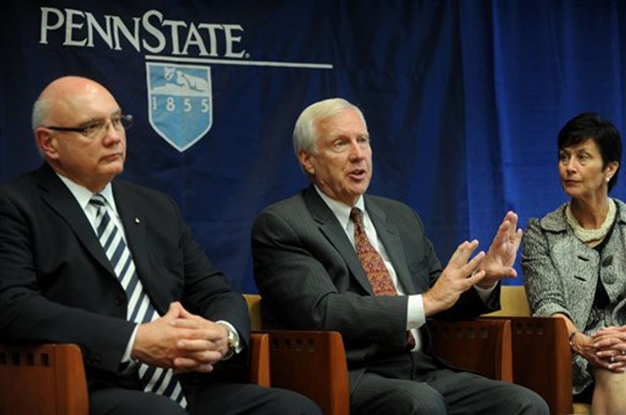 Penn State president Rodney Erickson, center, talks during an interview with the Centre Daily Times in State College, Pa., with interim athletic director Dave Joyner, left, and Board of Trustees chairwoman, Karen Peetz, on Monday, July 23, 2012. The NCAA crippled Penn State football for years to come, imposing an unprecedented $60 million fine and other punishments over the child sexual abuse scandal. (AP Photo/Centre Daily Times, Christopher Weddle)