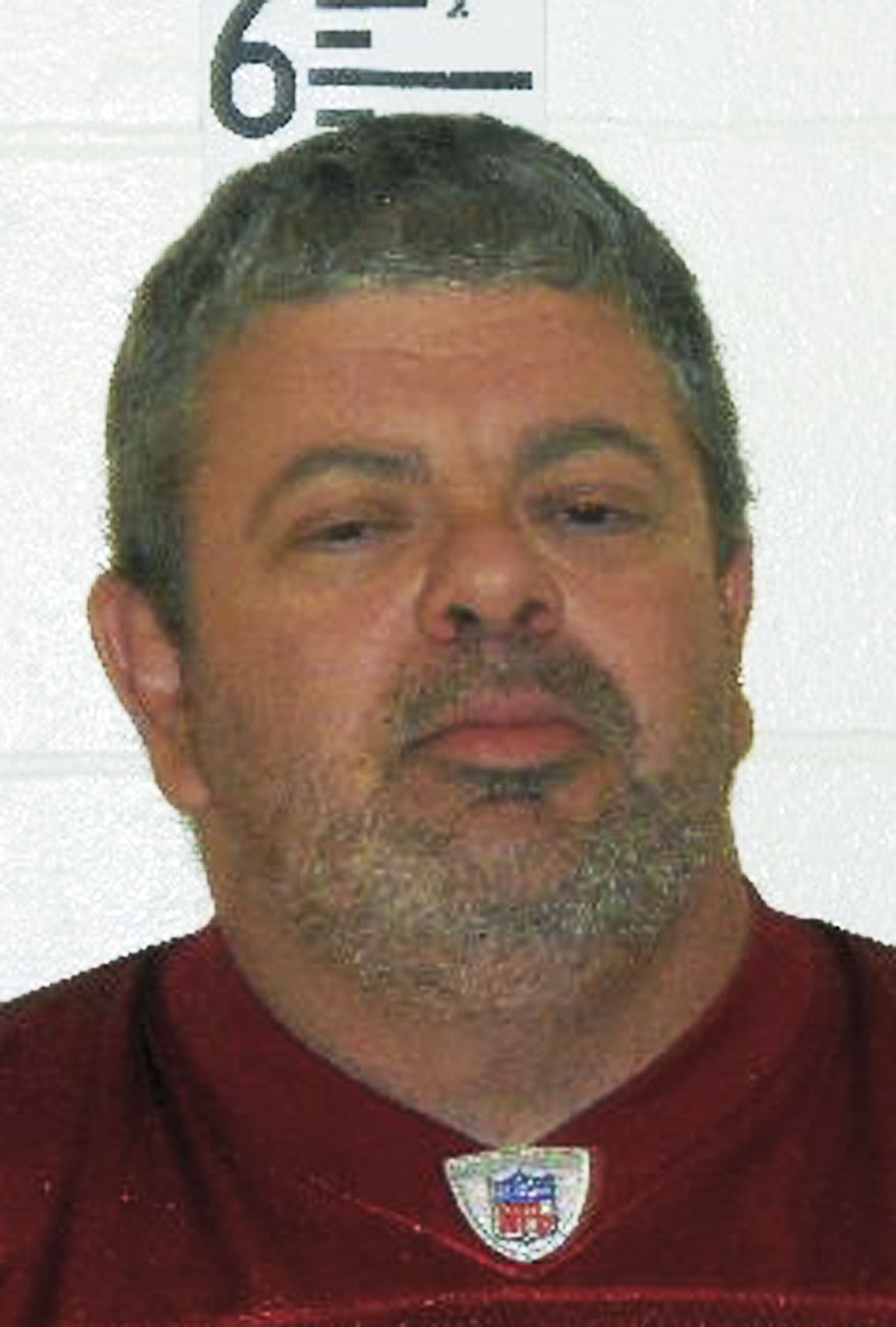This booking photograph released by the Maine State Police shows Timothy Courtois, who was arrested Sunday, July 22, 2012, on charges of having a concealed weapon and speeding on the Maine Turnpike. (AP Photo/Maine State Police)