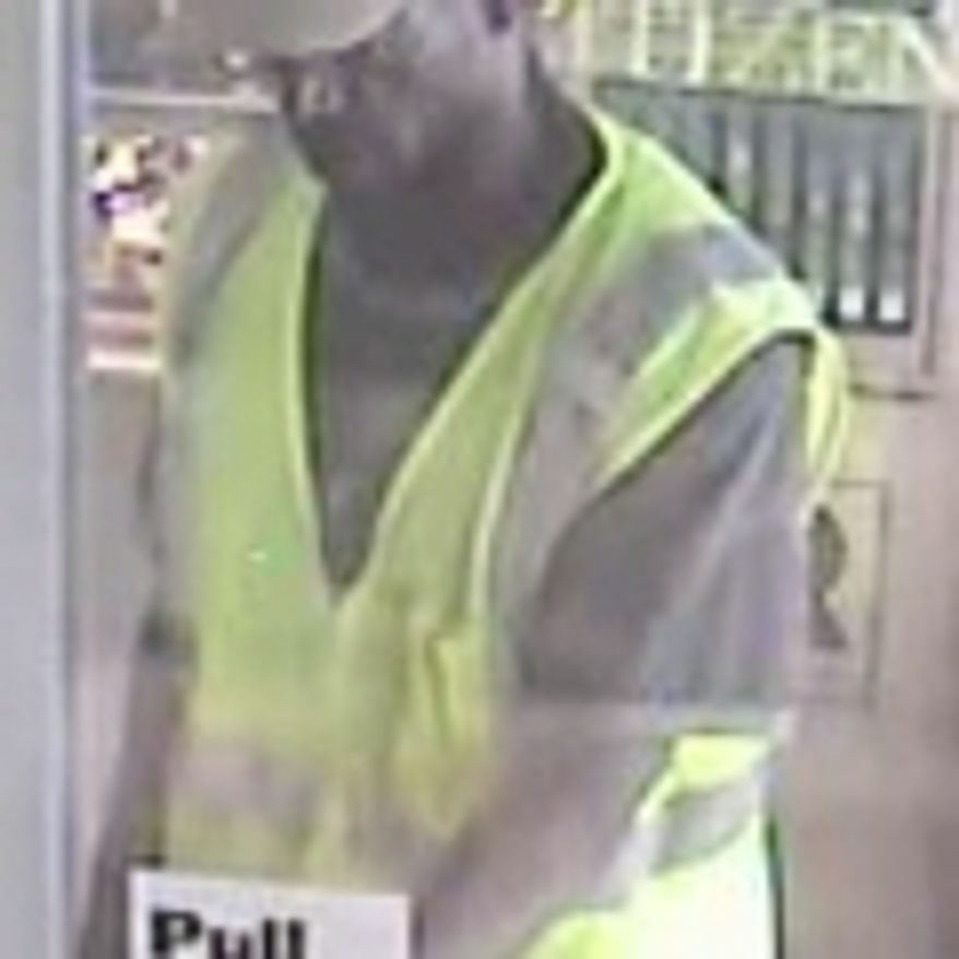 The suspect in the murder and robbery at a Columbia Pike jewelry store appears in a frame from the store's security camera. Photo from Arlington County police.
