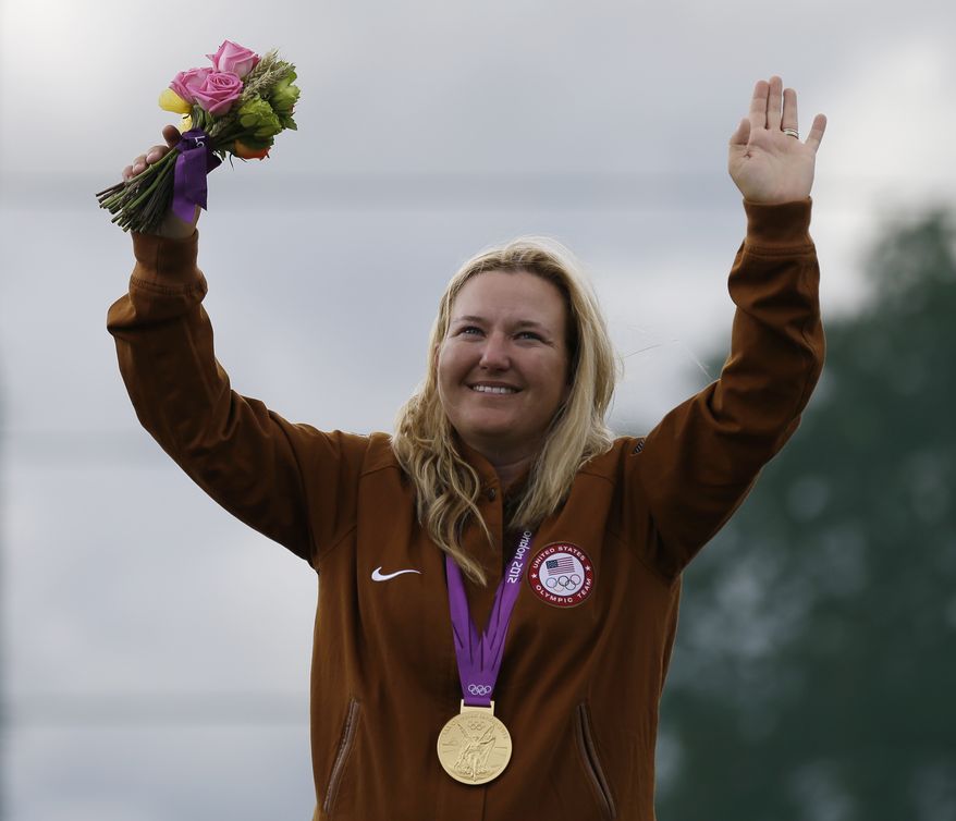 United States of America's Kimberley Rhode celebrates after winning the gold medal in the women's skeet, at the 2012 Summer Olympics, Sunday, July 29, 2012, in London. (AP Photo/Rebecca Blackwell)