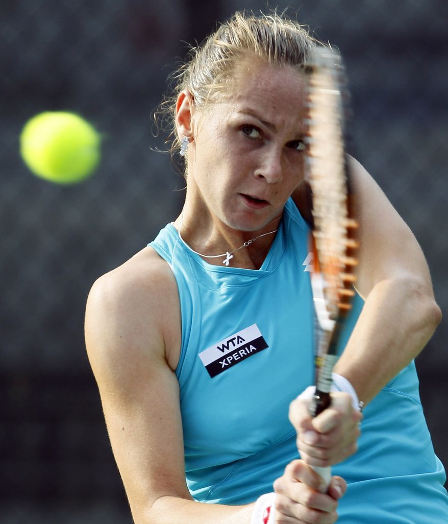 Magdalena Rybarikova, of Slovakia, returns a shot during a match against Chanelle Scheepers, of South Africa, at the City Open tennis tournament, Monday, July 30, 2012, in Washington. Rybarikova won 6-2, 6-1. (AP Photo/Carolyn Kaster)