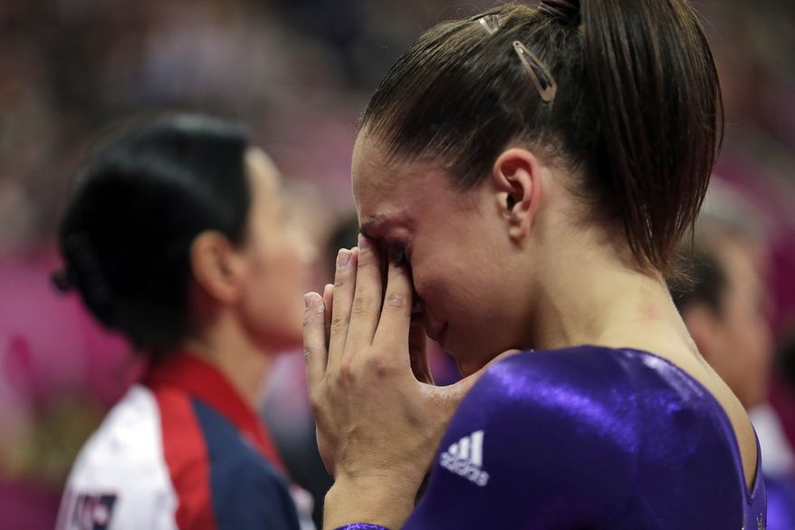 U.S. gymnast Jordyn Wieber cries after she failed to qualify for the women's all-around finals during the Artistic Gymnastics women's qualification at the 2012 Summer Olympics, Sunday, July 29, 2012, in London. (AP Photo/Gregory Bull)