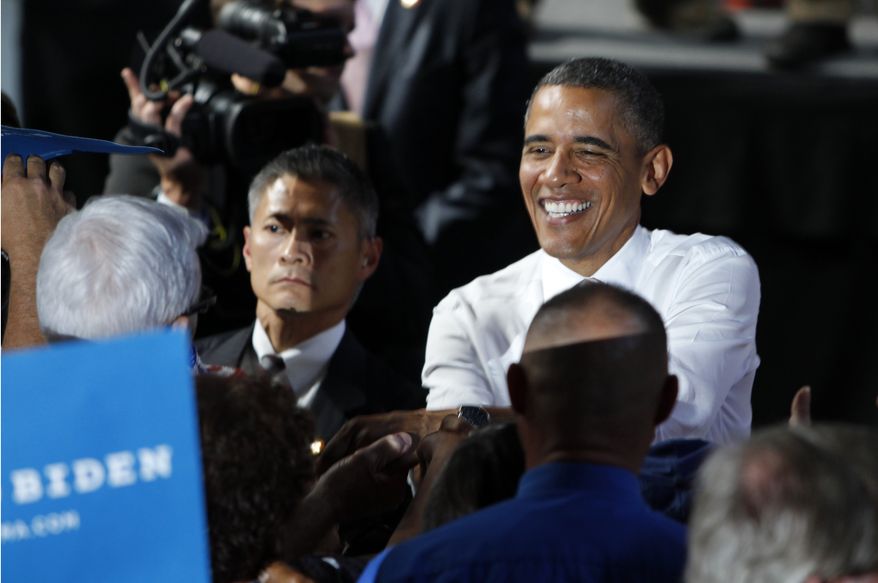 President Obama greets supporters Aug. 9, 2012, after a campaign event at the Colorado State Fairgrounds in Pueblo, Colo. (Associated Press)