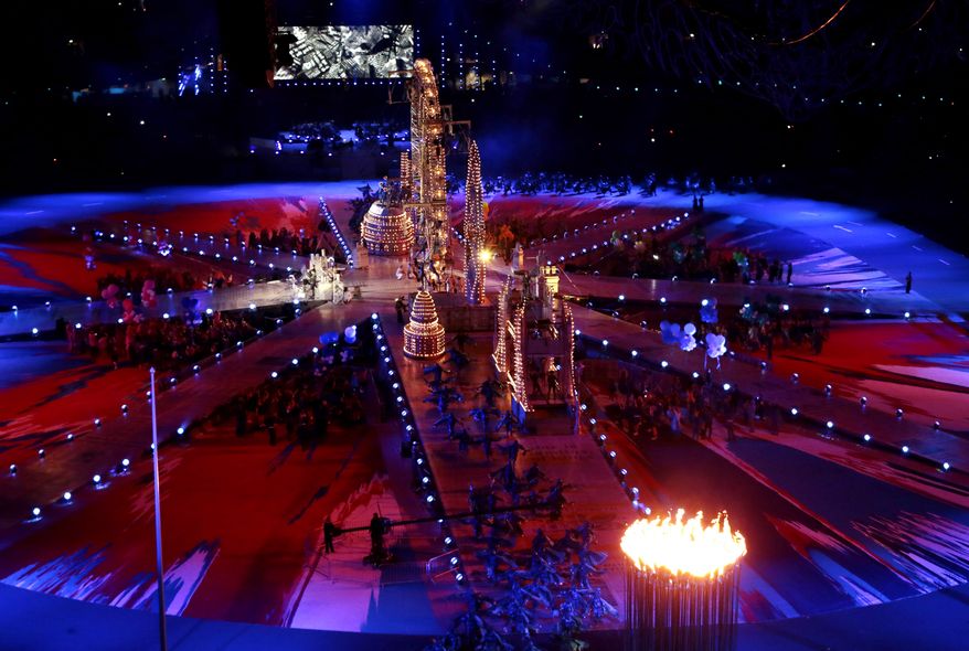 Performers dance on a stage set with London landmarks during the Closing Ceremony at the 2012 Summer Olympics, Sunday, Aug. 12, 2012, in London. (AP Photo/Ivan Sekretarev)