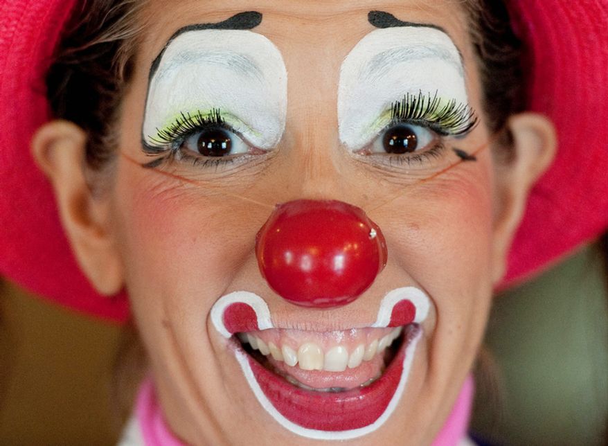 Julie Varholdt, aka "Lovely Buttons," poses for a portrait at the third annual Clown Campin' in Ontario, Calif. The week long event is held for clowns across the United States and Canada to learn, get inspired, and network. (AP Photo/Grant Hindsley)