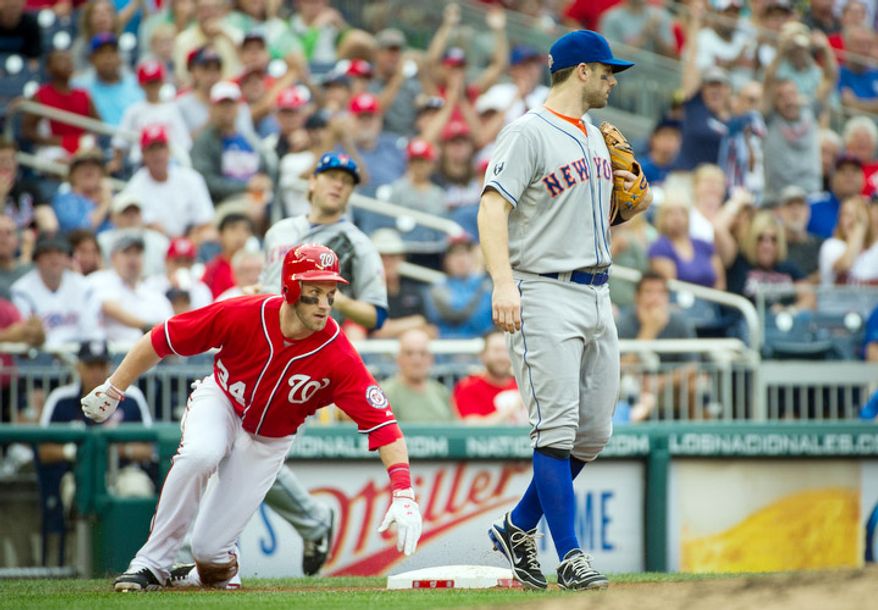 Washington Nationals Bryce Harper (34) is safe at third on an RBI triple, scoring Jayson Werth in the bottom of the third inning. (Rod Lamkey Jr./The Washington Times)