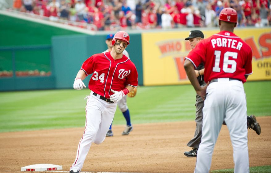 Washington Nationals Bryce Harper makes his way around third base after his solo home run in the bottom of the fifth inning. The Nationals defeated the Mets 5-2. (Rod Lamkey Jr./The Washington Times)
