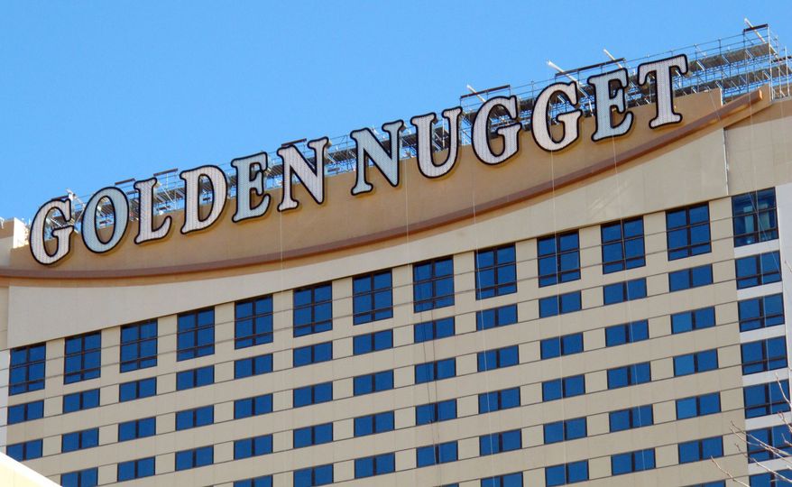 The Golden Nugget Atlantic City is suing a group of gamblers who won $1.5 million in an April game of mini-baccarat. The casino says the eight decks of cards were not shuffled by the manufacturer before being placed into use. (Associated Press)