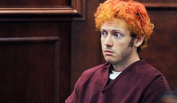 ** FILE ** Prosecutors say James Holmes, seen here in court July 23, 2012, was banned from the University of Colorado. (Associated Press)