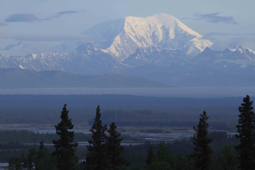 ** FILE ** Early morning sun shines on the south side of 17,400-foot Mount Foraker in Denali National Park on Sunday, Aug. 12, 2012, in a view from Talkeetna, Alaska. (AP Photo/Dan Joling)
