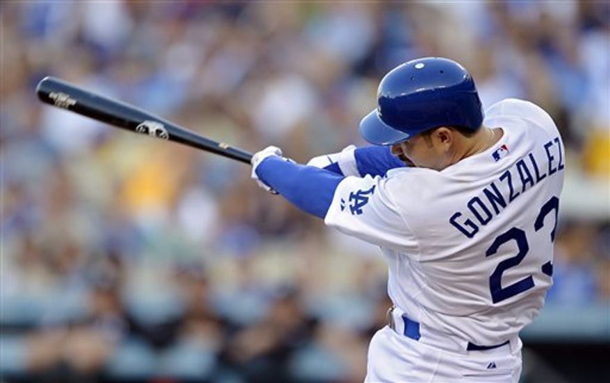 Los Angeles Dodgers' Adrian Gonzalez swings on a three-run home run during the first inning of a baseball game against the Miami Marlins, Saturday, Aug. 25, 2012, in Los Angeles. (AP Photo/Mark J. Terrill)