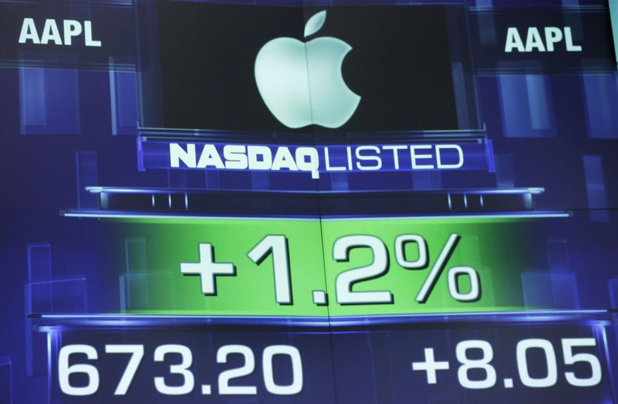 **FILE** The Apple share price is seen here Aug. 21, 2012, on a stock ticker at the Nasdaq MarketSite in New York. (Associated Press)