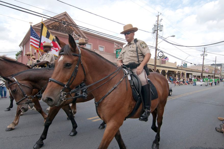 Maryland mounty police ride during the Labor Day parade. (Craig Bisacre/The Washington Times)