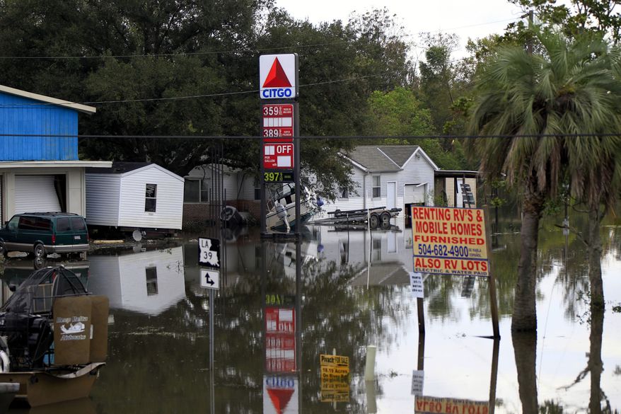 Floodwaters from Hurricane Isaac inundate structures in Scaresdale, La., on Sunday, Sept. 2, 2012. (AP Photo/Gerald Herbert)