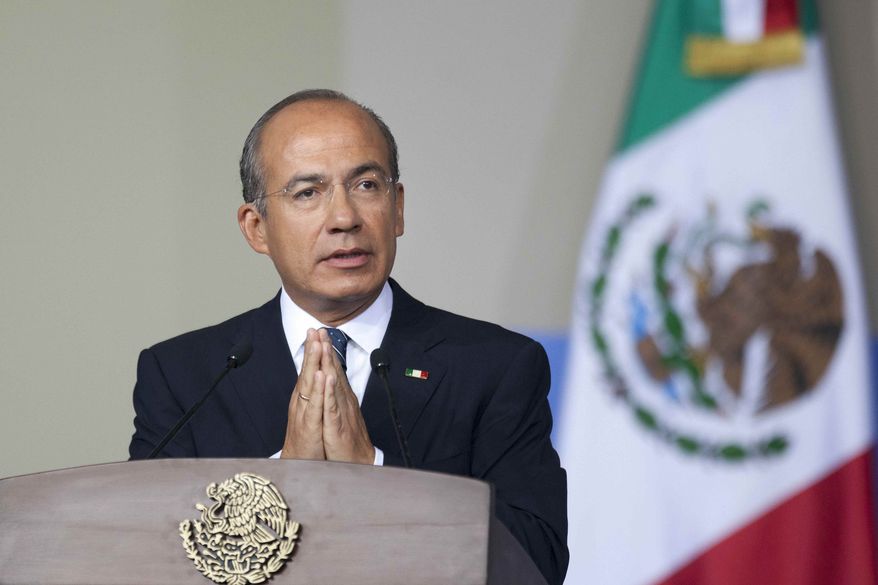 Mexican President Felipe Calderon delivers his state-of-the-nation address to Congress in Mexico City on Monday, Sept. 3, 2012. (AP Photo/Alexandre Meneghini)