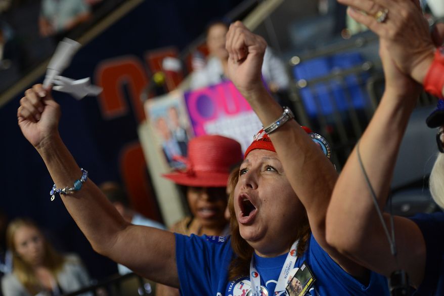 Texas delegate Tina Guerrera, of San Antonio, Tex., cheers a speaker during the Democratic National Convention at the Time Warner Arena in Charlotte, N.C., on Wednesday, September 5, 2012. (Barbara Salisbury/ The Washington Times)